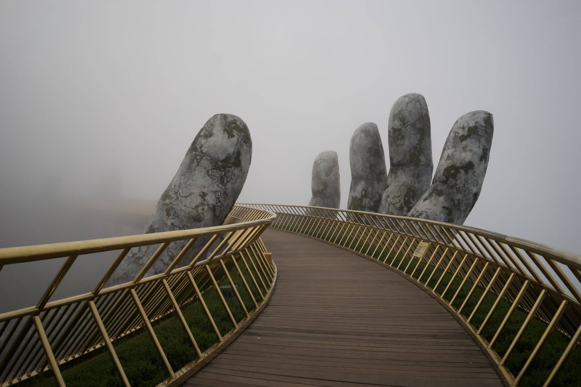 Image of a stone reaching up from the fog to grasp a bridge