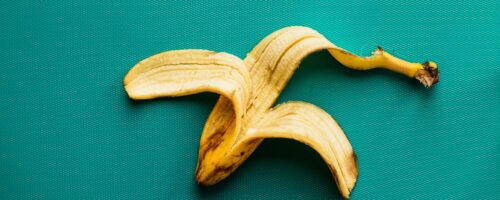 banana peel on a teal surface