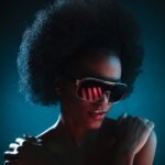 Black woman with afro wearing cool sunglasses