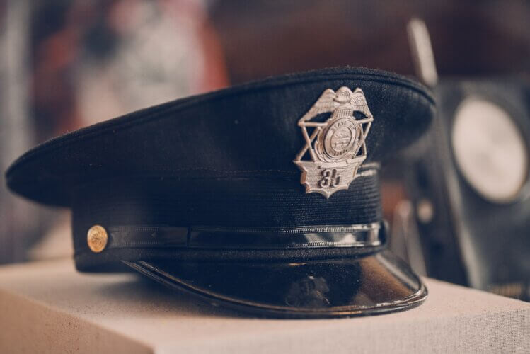A police officer cap on small tabletop