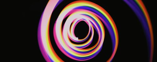 image of a colorful but slightly menacing and jagged spiral on a black background