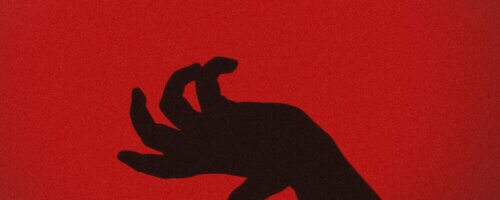 A silhouetted black hand in front of a dark red background, open and fingers curled as if to slap or grab something