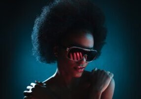 Black woman with afro wearing cool sunglasses